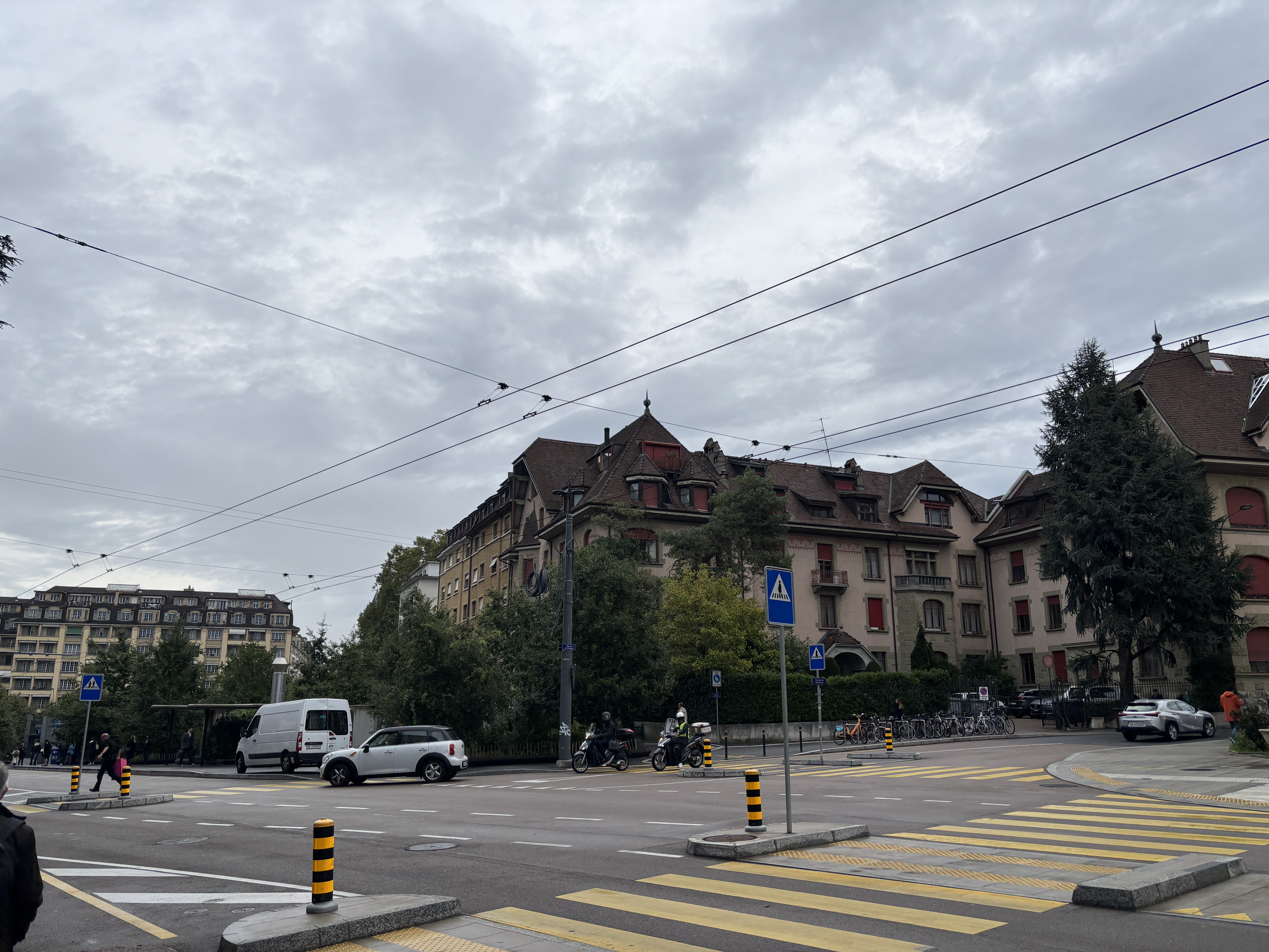 Geneva street crossing beneath tram and trolley wires