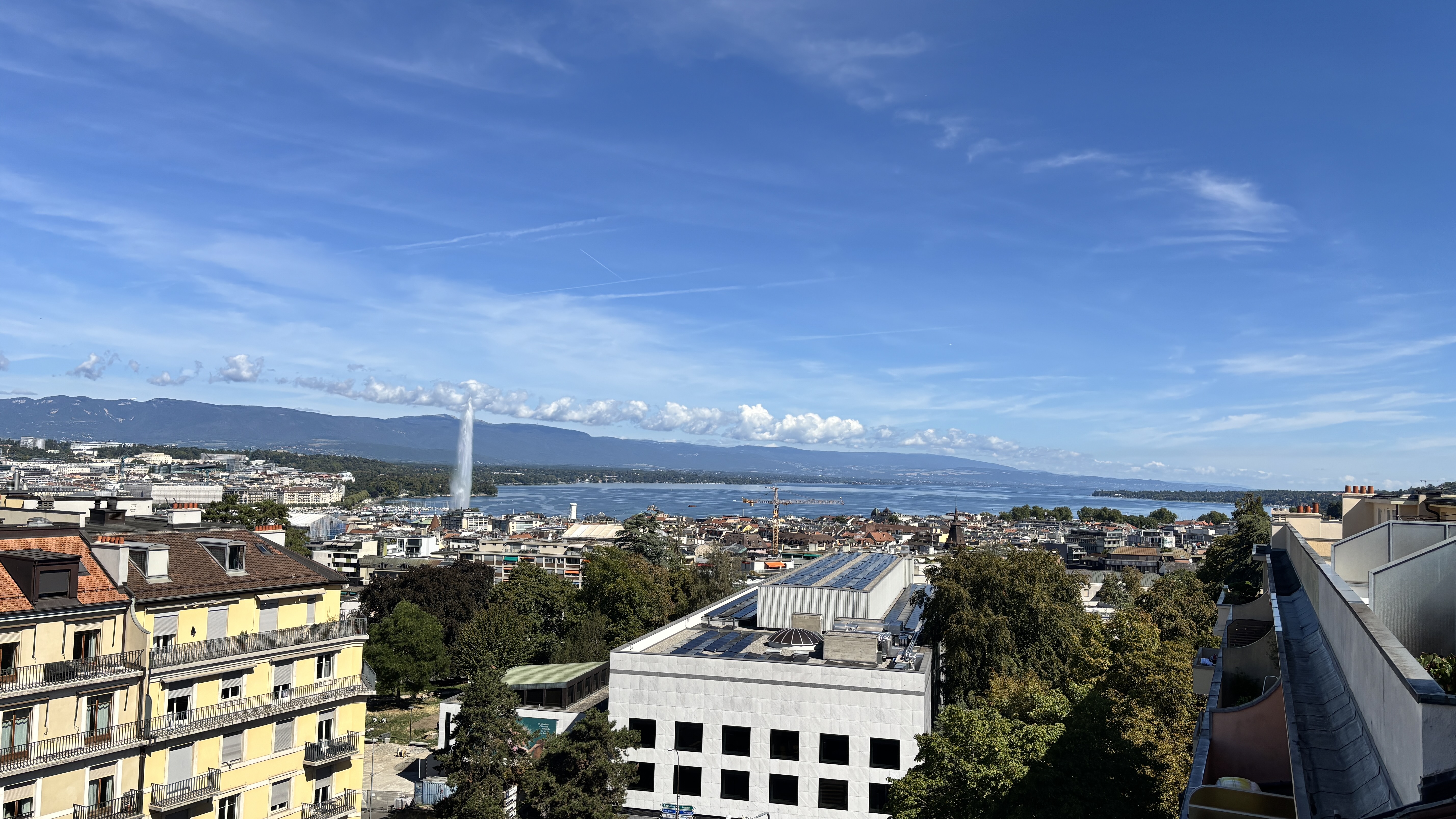 Geneva panorama with the Jet d'Eau, lake and mountains